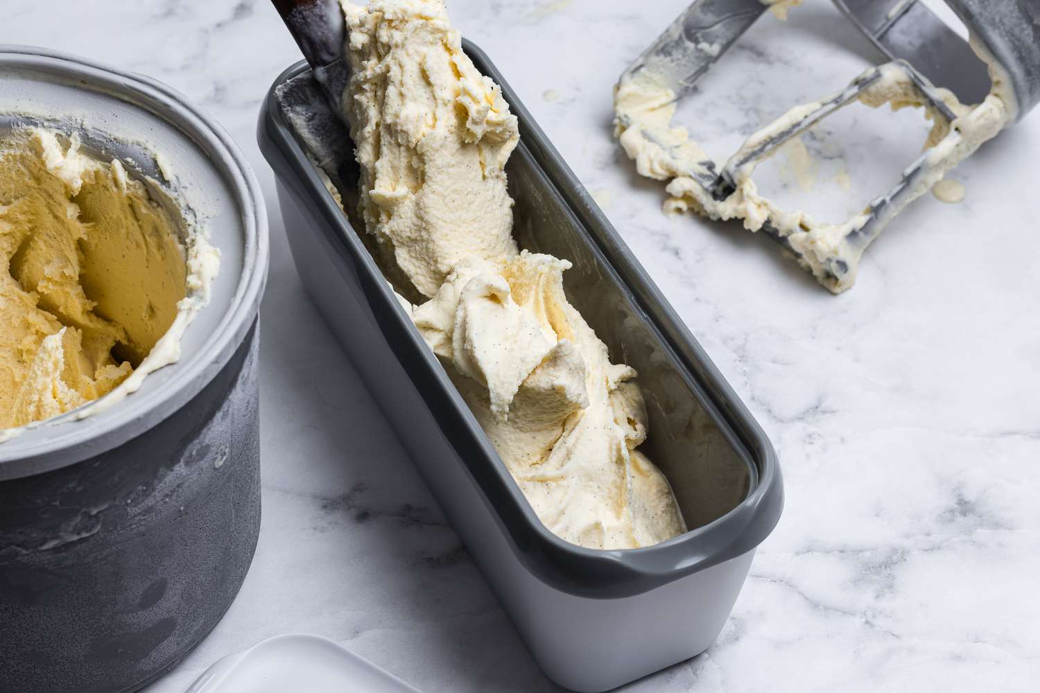 Freezing the vanilla ice cream in a freezer container.