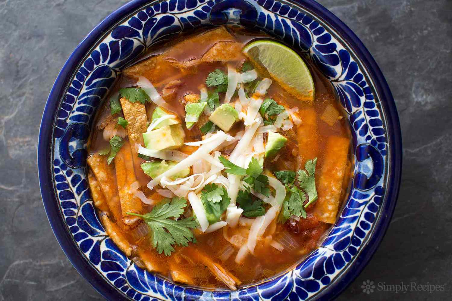 turkey tortilla soup in a blue bowl