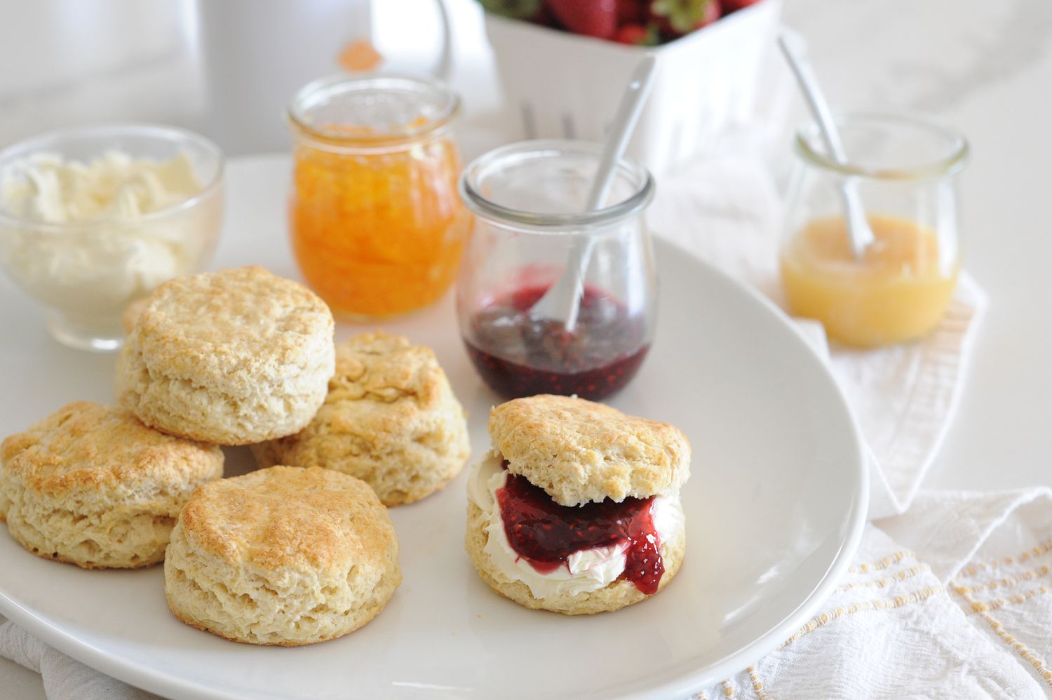 English-Style Scones on a tray with jam.