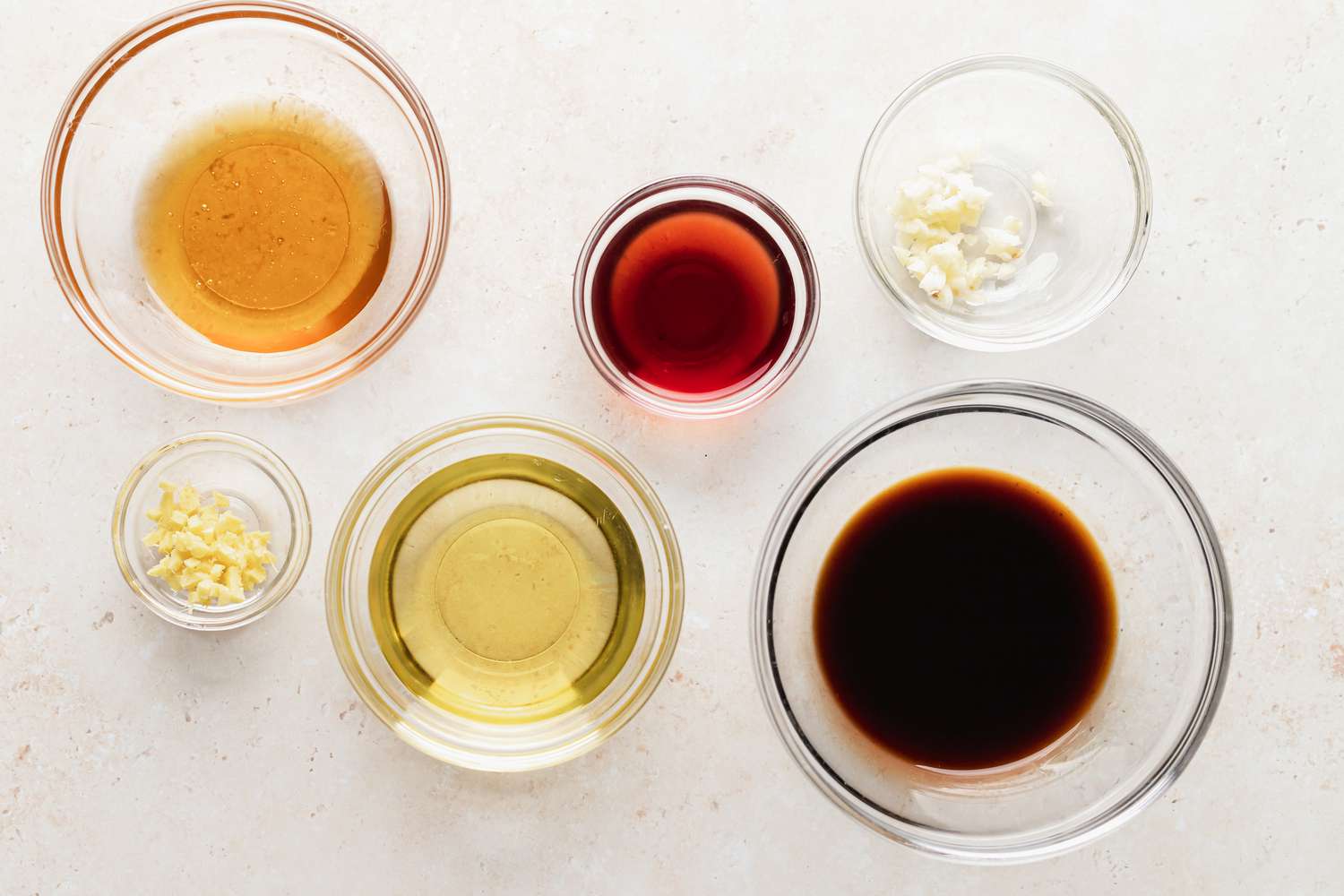 Prep bowls with ingredients to make the marinade for kebabs.