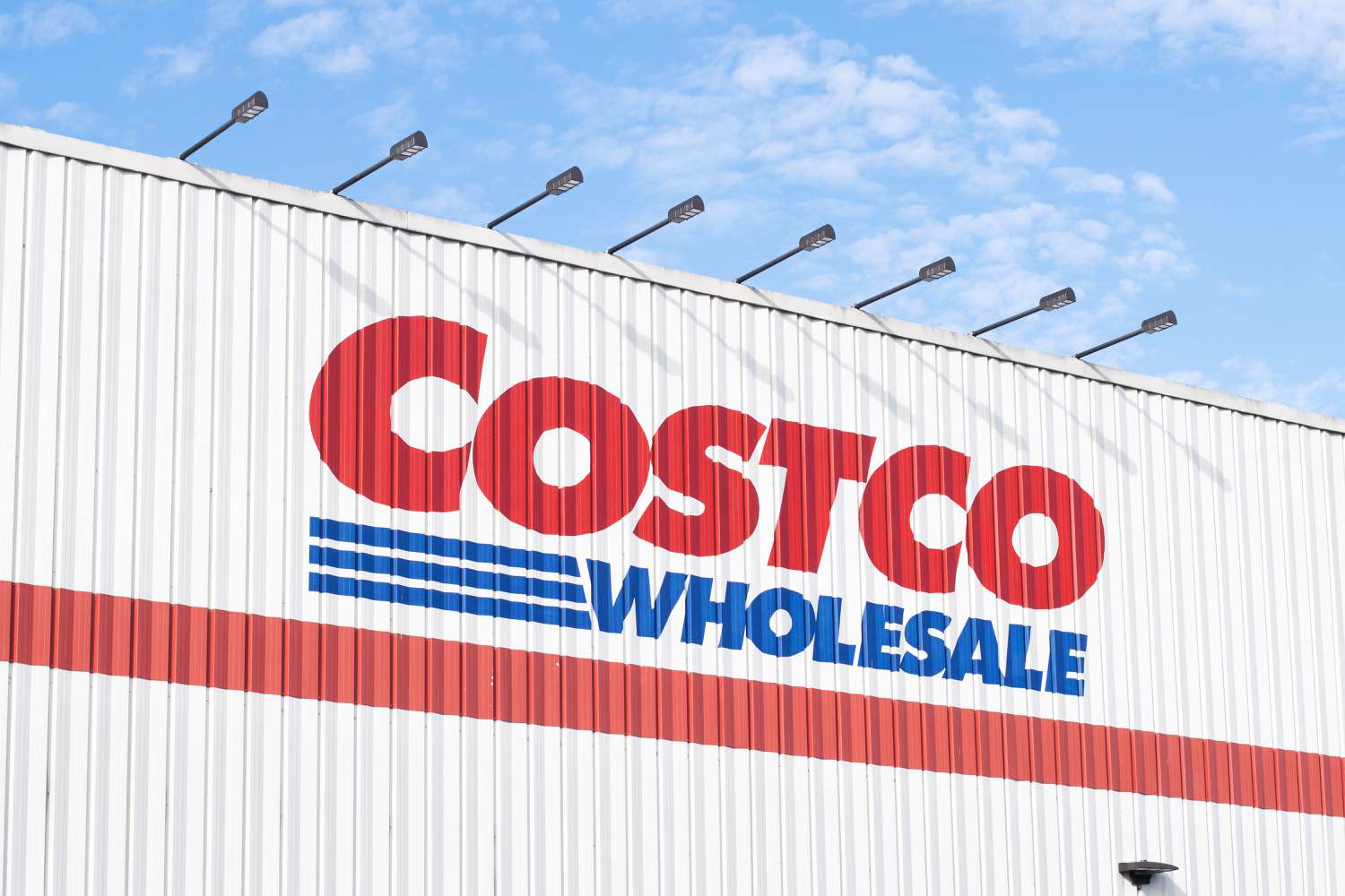 Image of the Costco logo on the metal siding of a Costco store
