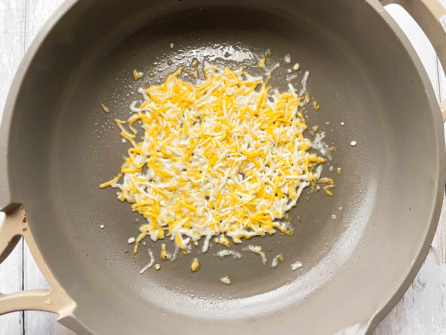 Cheese on Skillet for Burnt Cheese Tacos