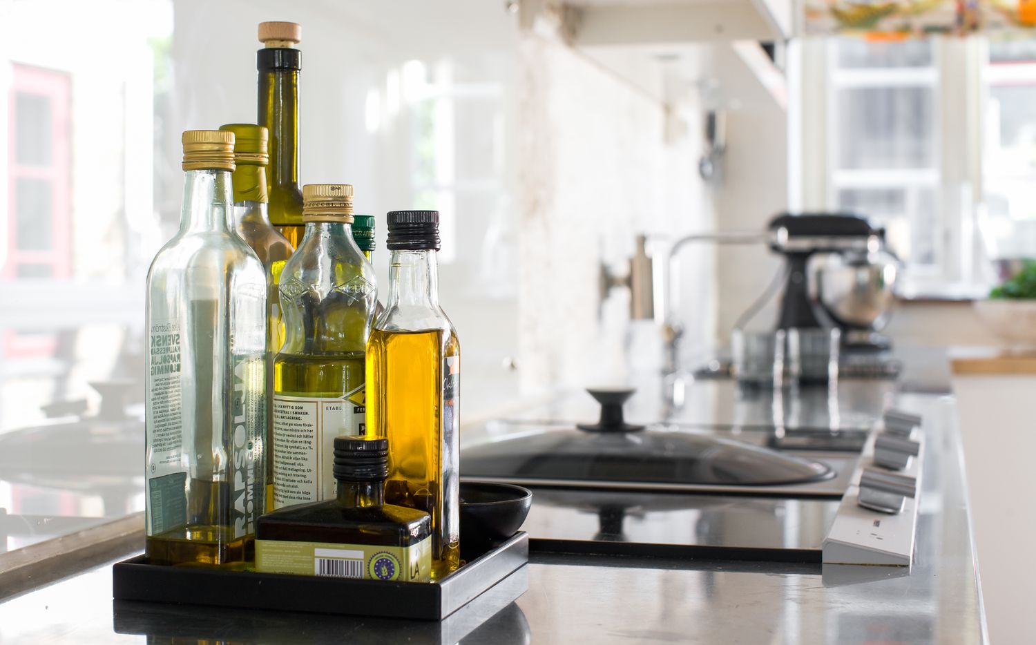 different types of olive oil on the counter 
