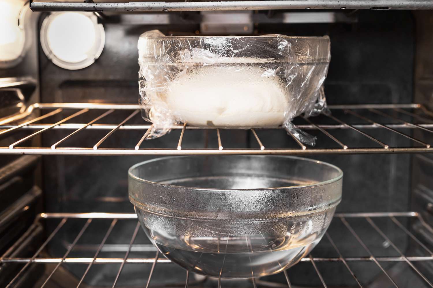 Steaming bowl of water in the oven to help proof dough quickly