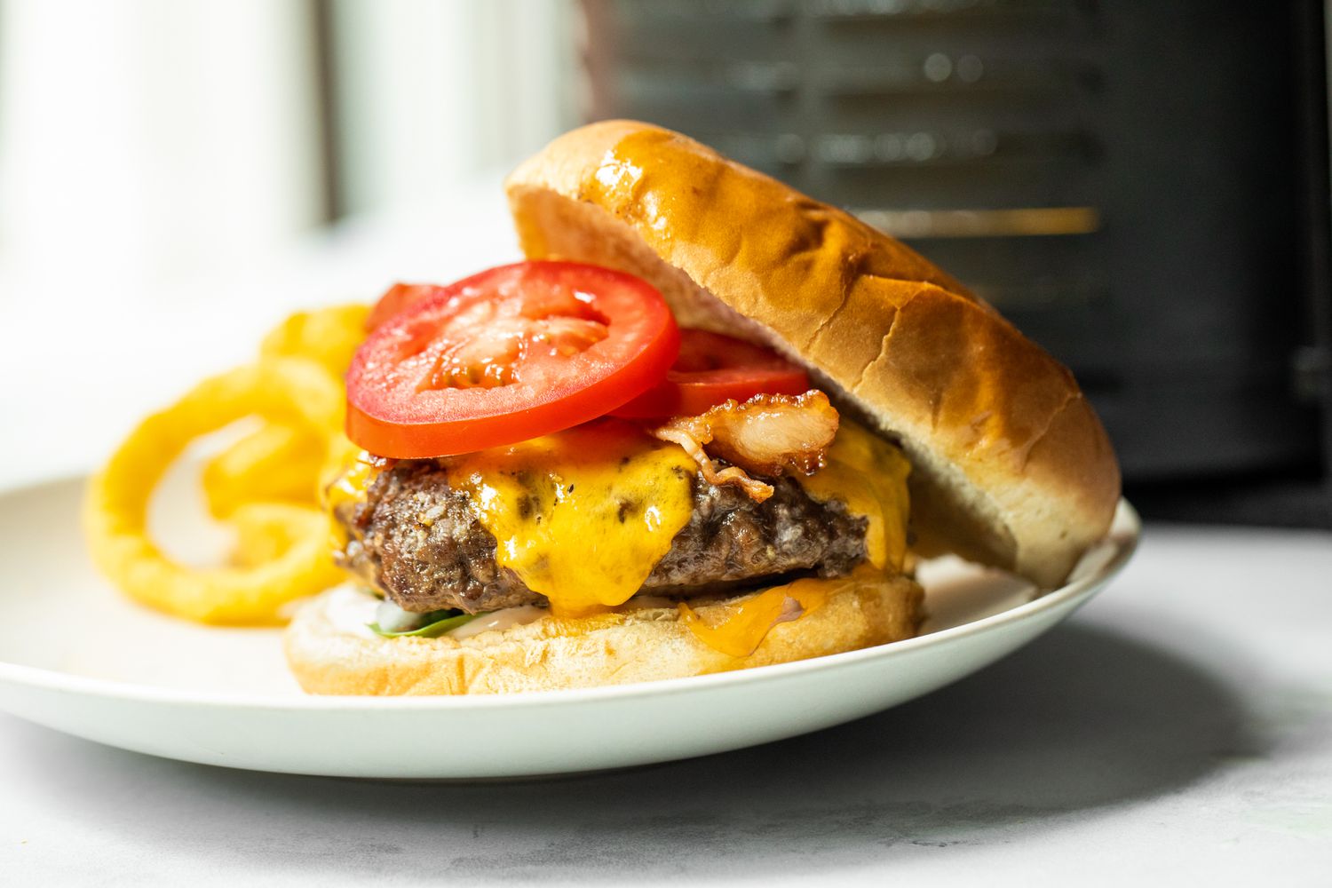 Air Fryer Burger on a Plate with Onion Rings