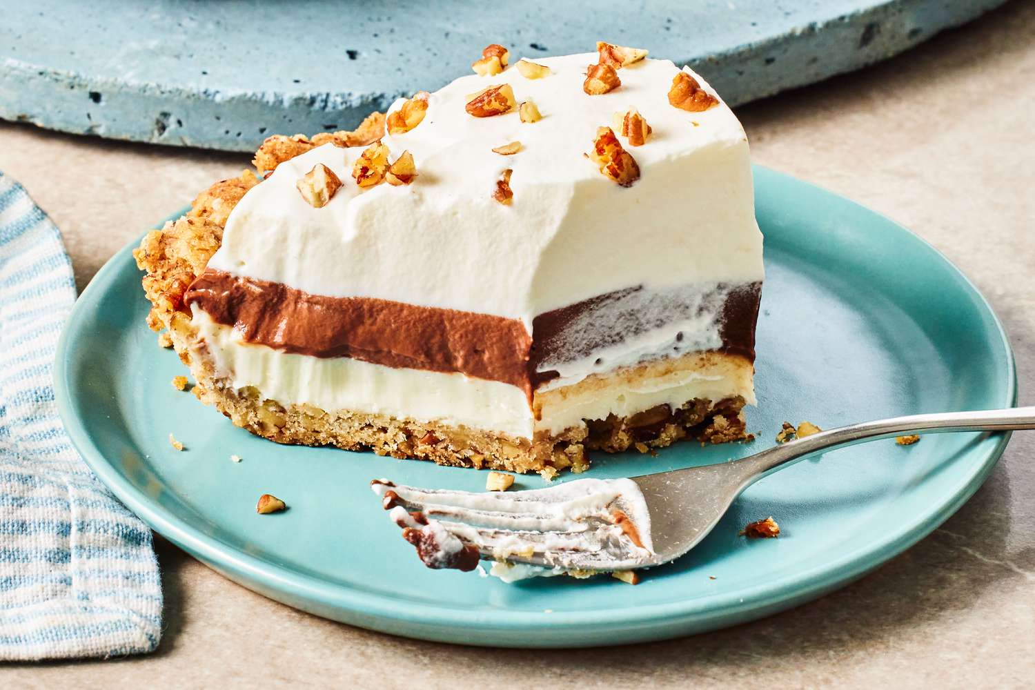 a slice of Arkansas Possum Pie on a plate with a fork