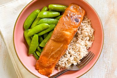 Triple M Salmon Served With Brown Rice and Edamame in a Bowl With a Fork