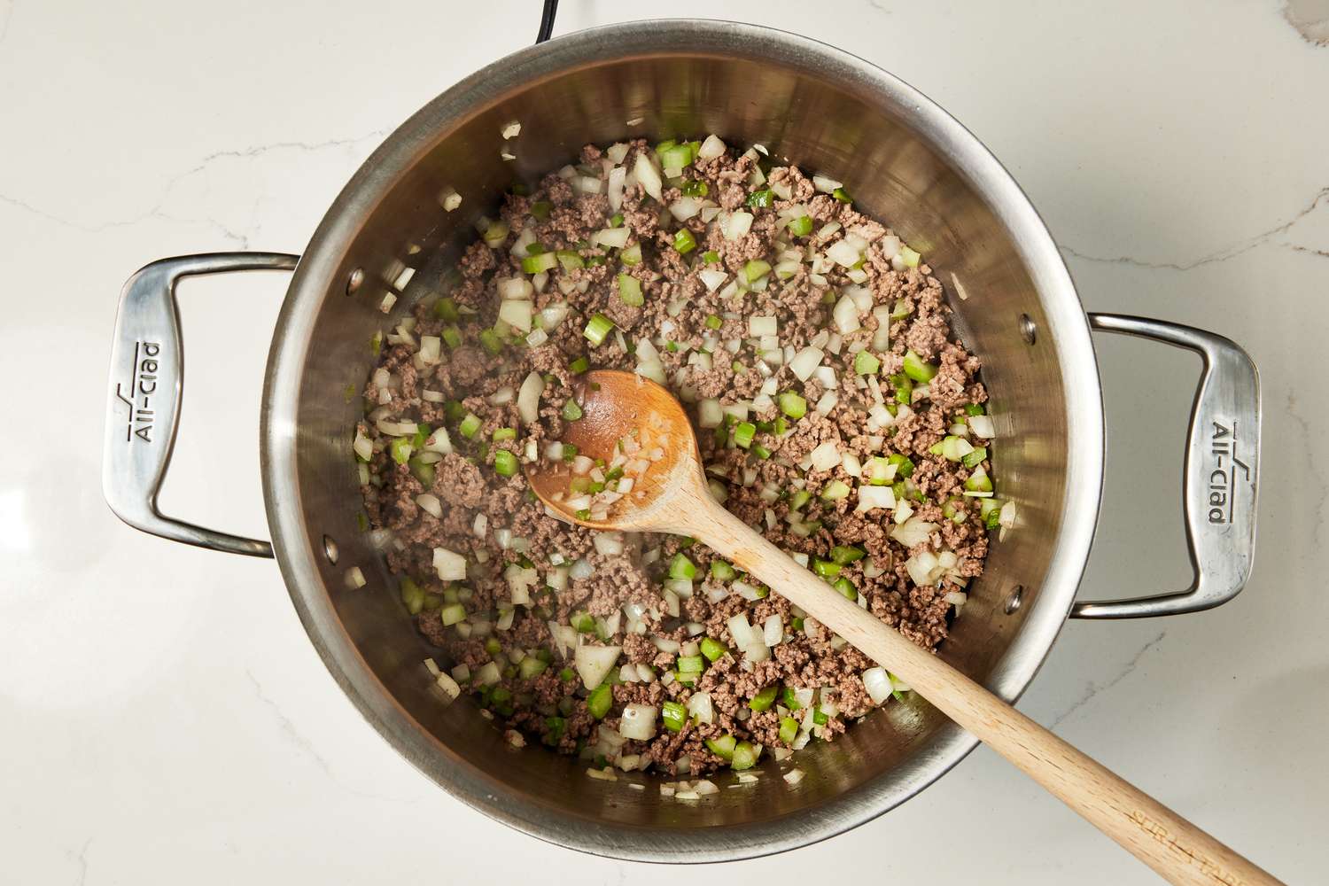 Ground beef and vegetables sauteed the pot for copycat Wendy's chili recipe