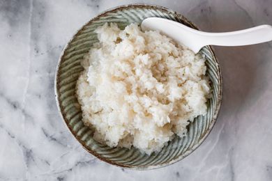 Sushi Rice in a Bowl with a Rice Paddle
