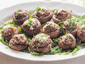 Stuffed mushroom caps on an appetizer tray