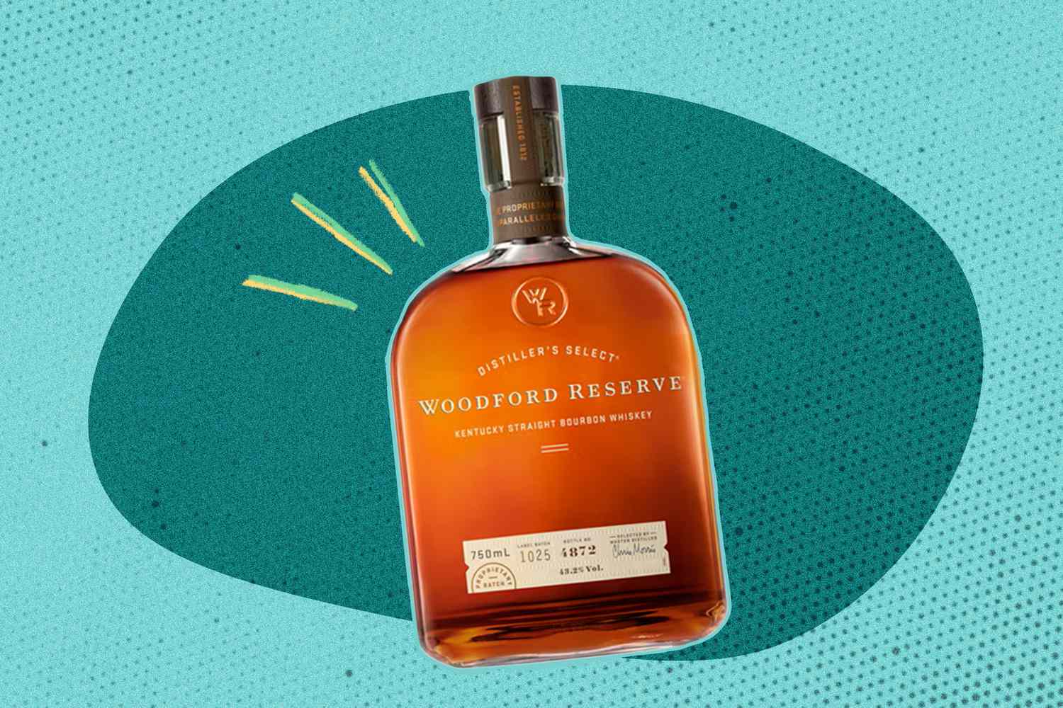 Bottle of Woodford Preserve bourbon on a dark and light blue speckled background