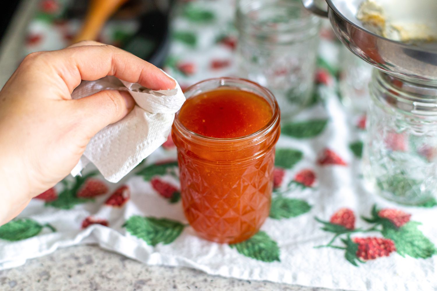 Wipe Rim of Jar for Peach and Pineapple Jam Recipe