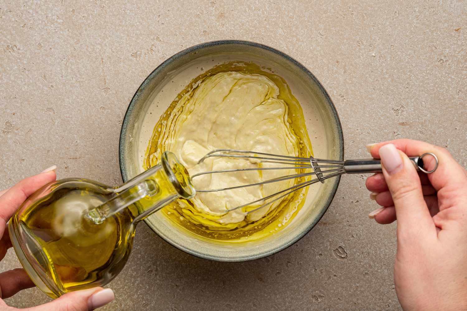 Oil Whisked into Bowl of Caesar Dressing 