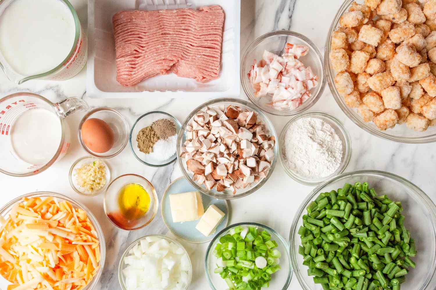 The hotdish ingredients laid out on a marble countertop
