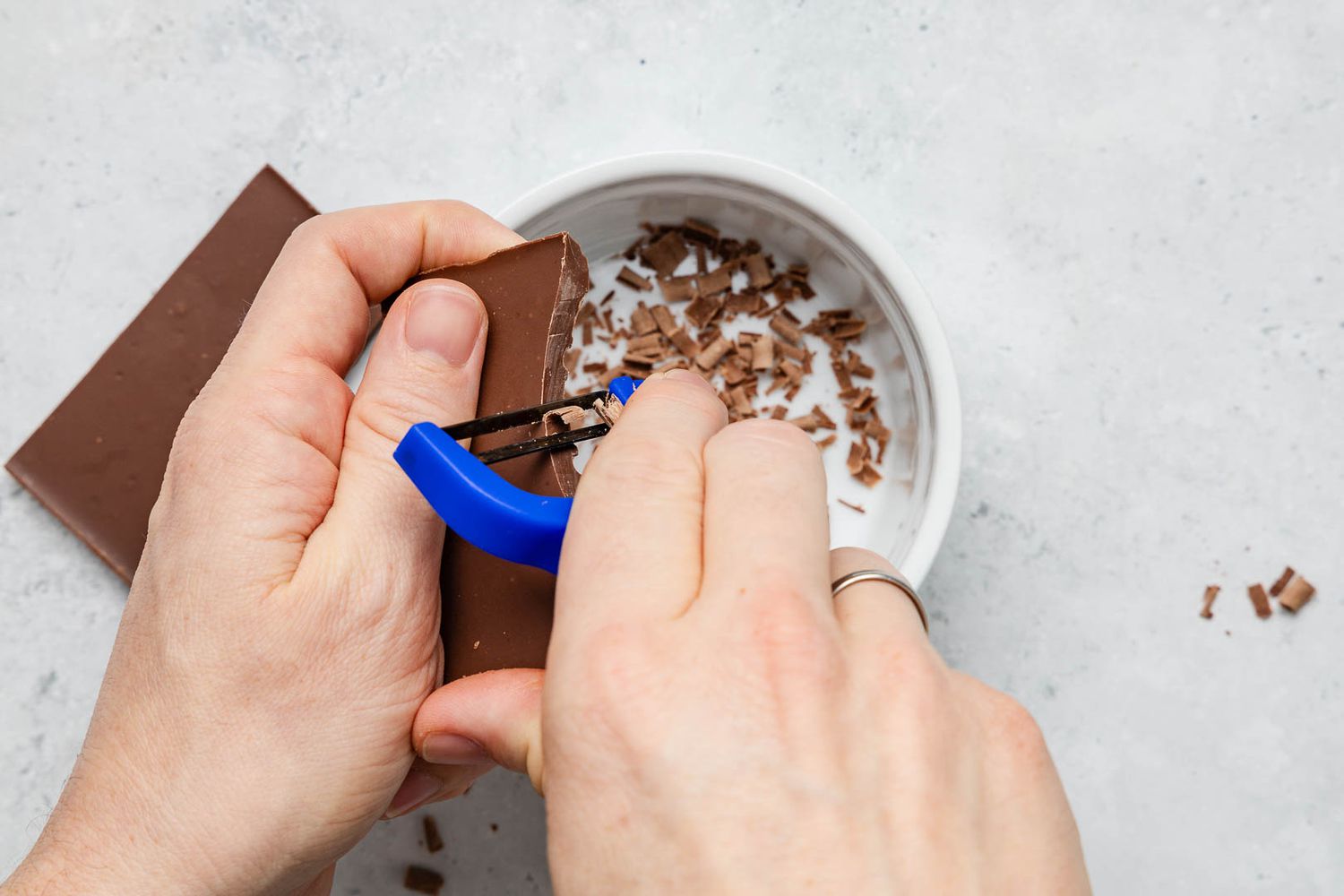 Milk chocolate shaved using a vegetable peeler for ritz torte recipe