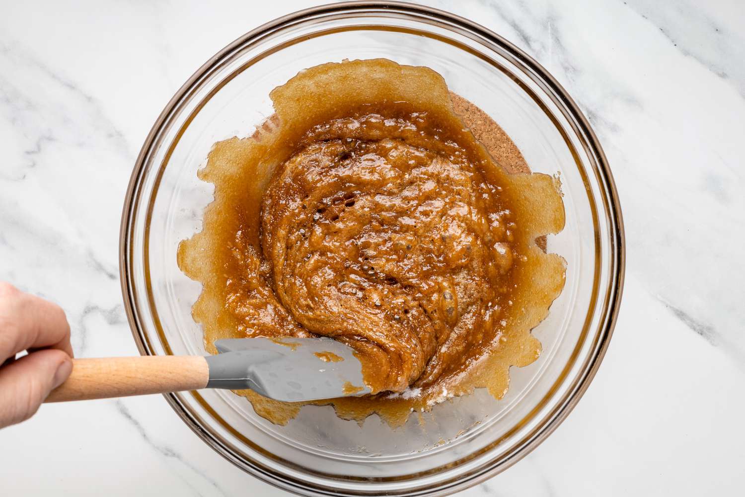 stirring caramel in bowl