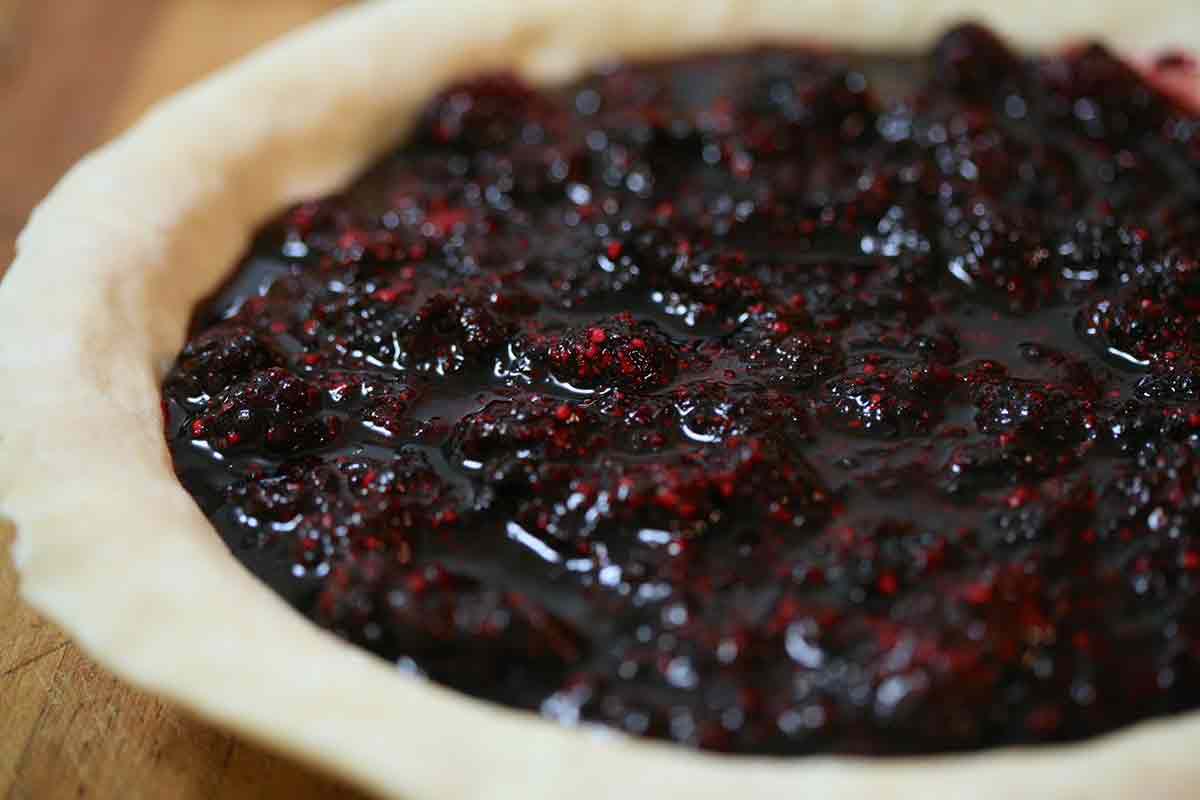 add boysenberry filling to the pie crust for boysenberry pie