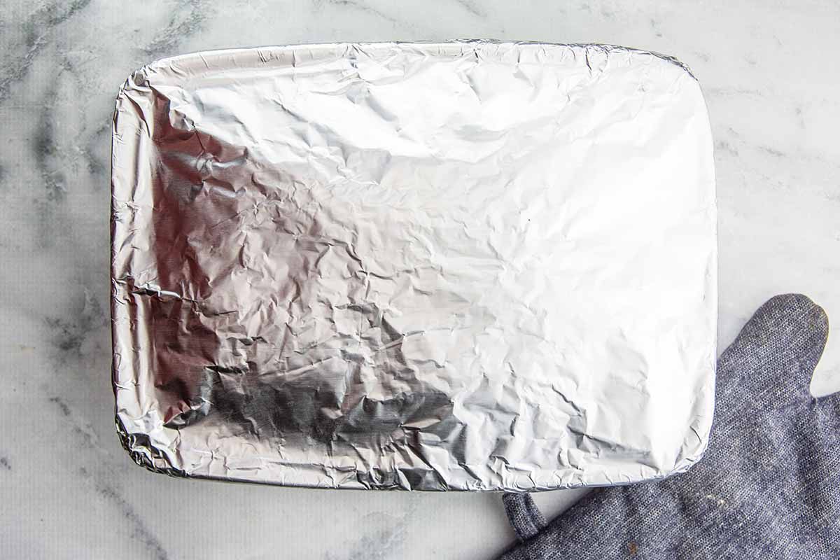 Easy Biryani with Chicken put foil over the top