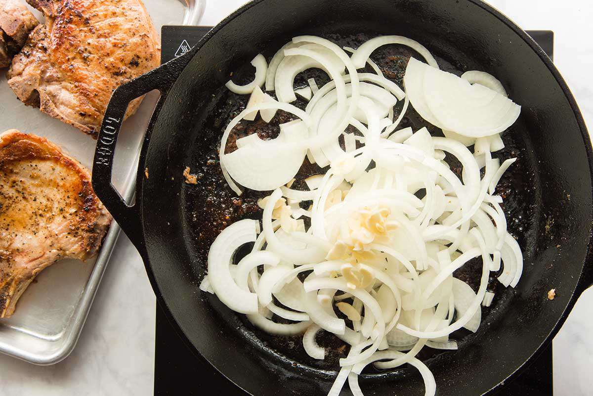 Onions sauteed in a cast iron skillet