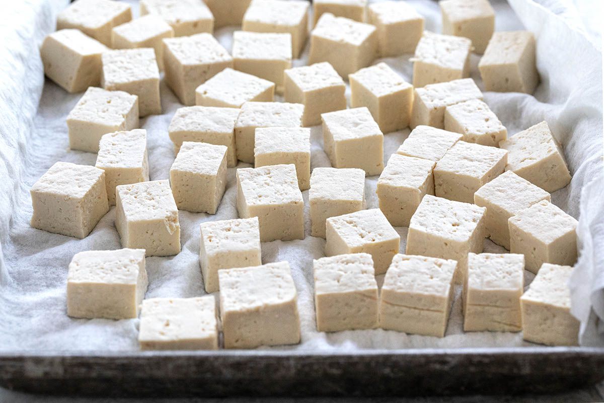 Cubed tofu on a baking sheet to make Vegetarian Stir Fry with Tofu.
