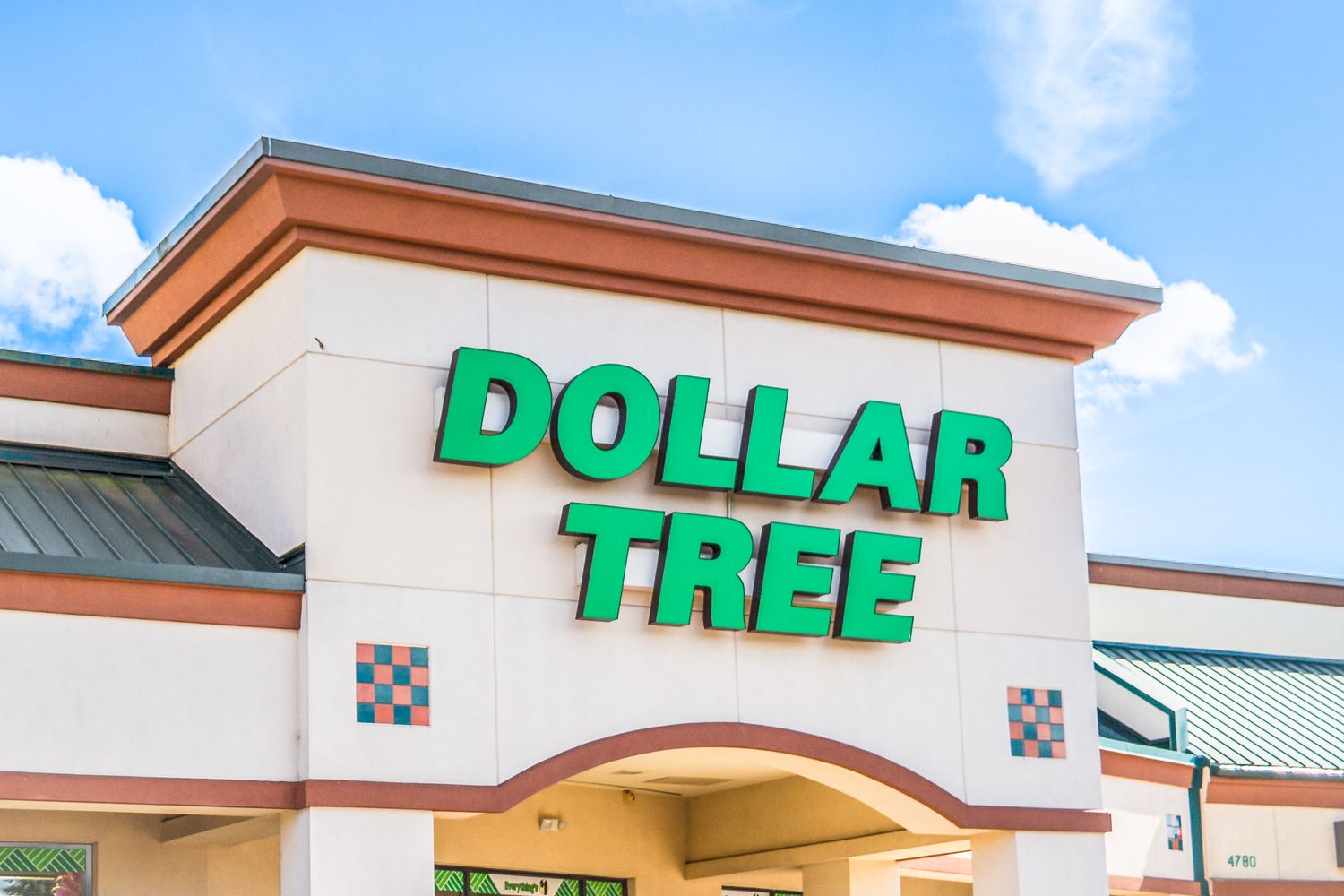 Entrance of a Dollar Tree store with its name displayed on the building