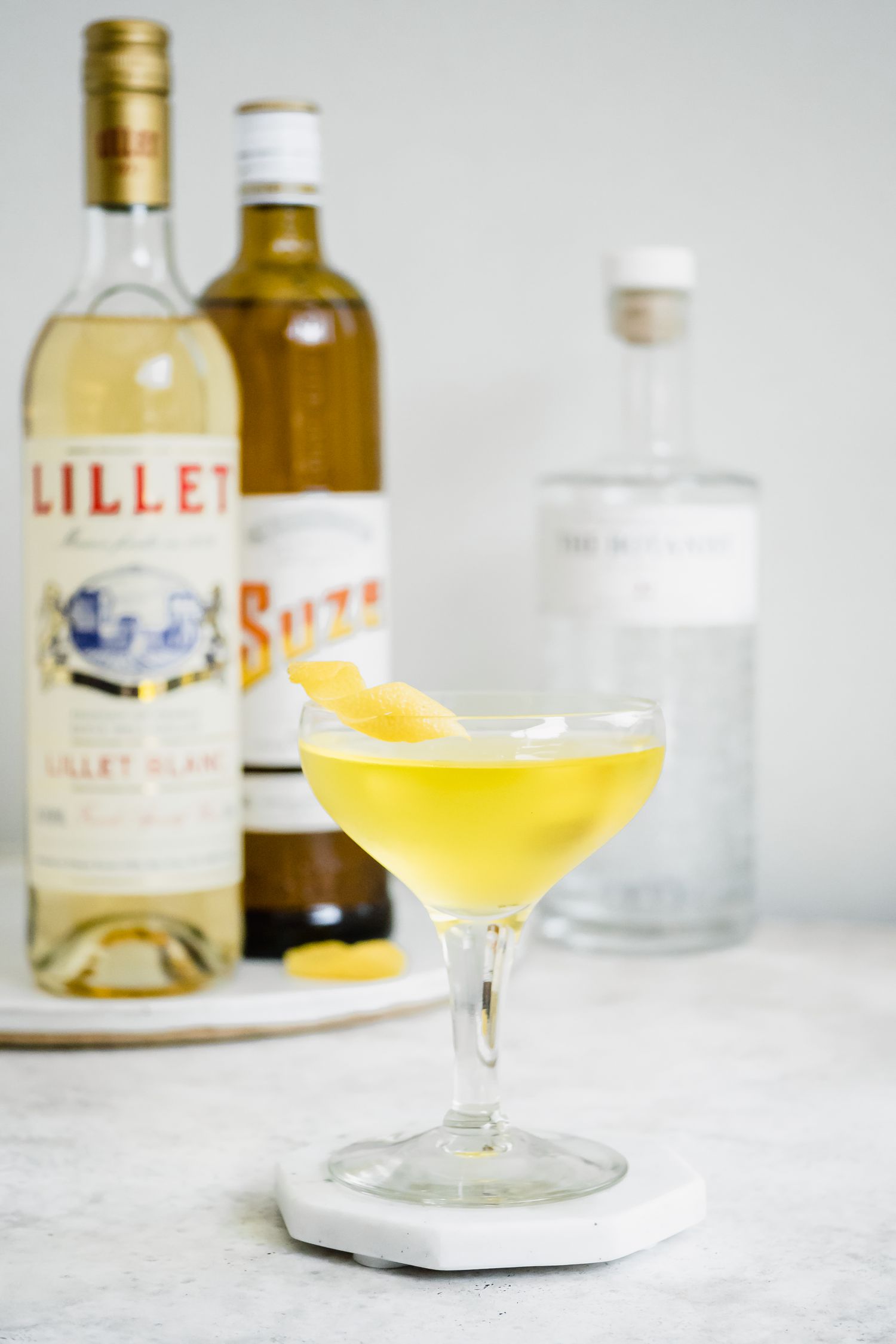 White Negroni with Ingredients in Background