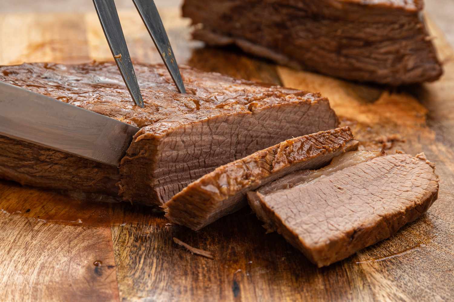 Slicing a cooked Beef Brisket across the grain