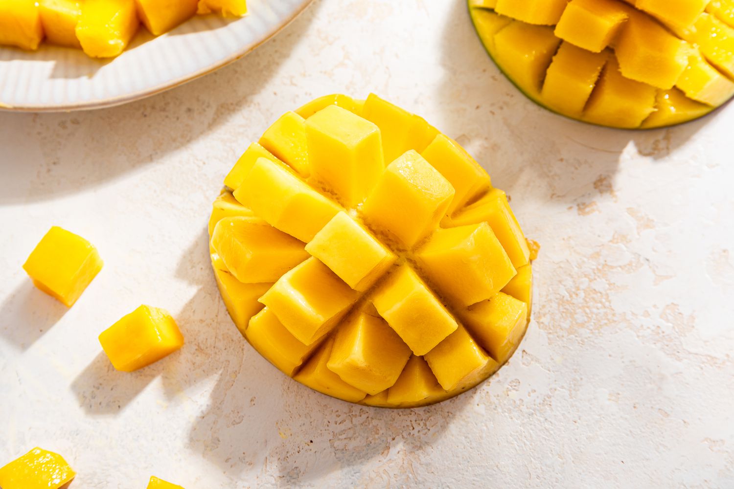 mango cubes (still attached to mango skin) for mango float recipe