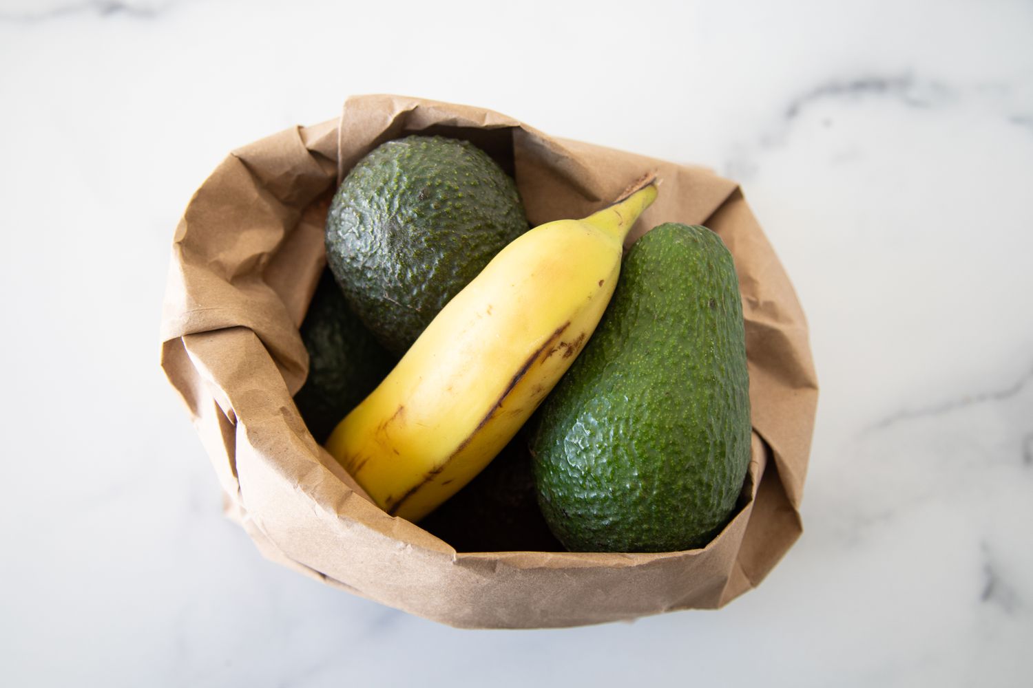 Avocados and a Banana in a Paper Bag 