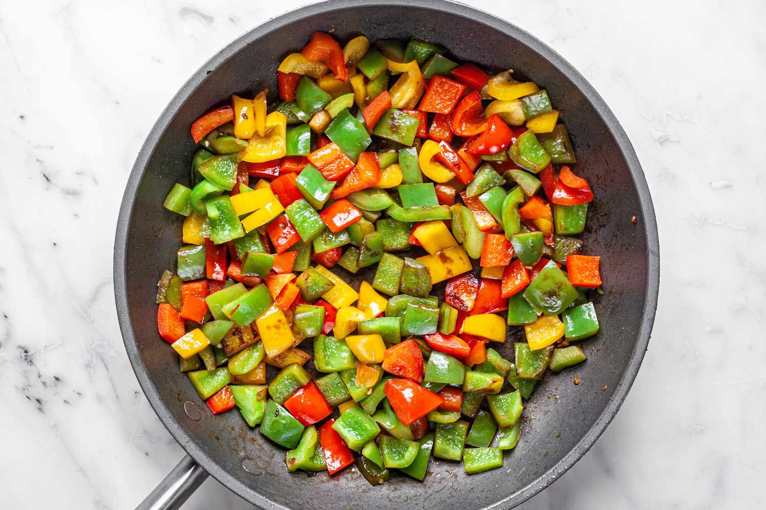 Bell Peppers Cooked in a Skillet for Ratatouille Recipe