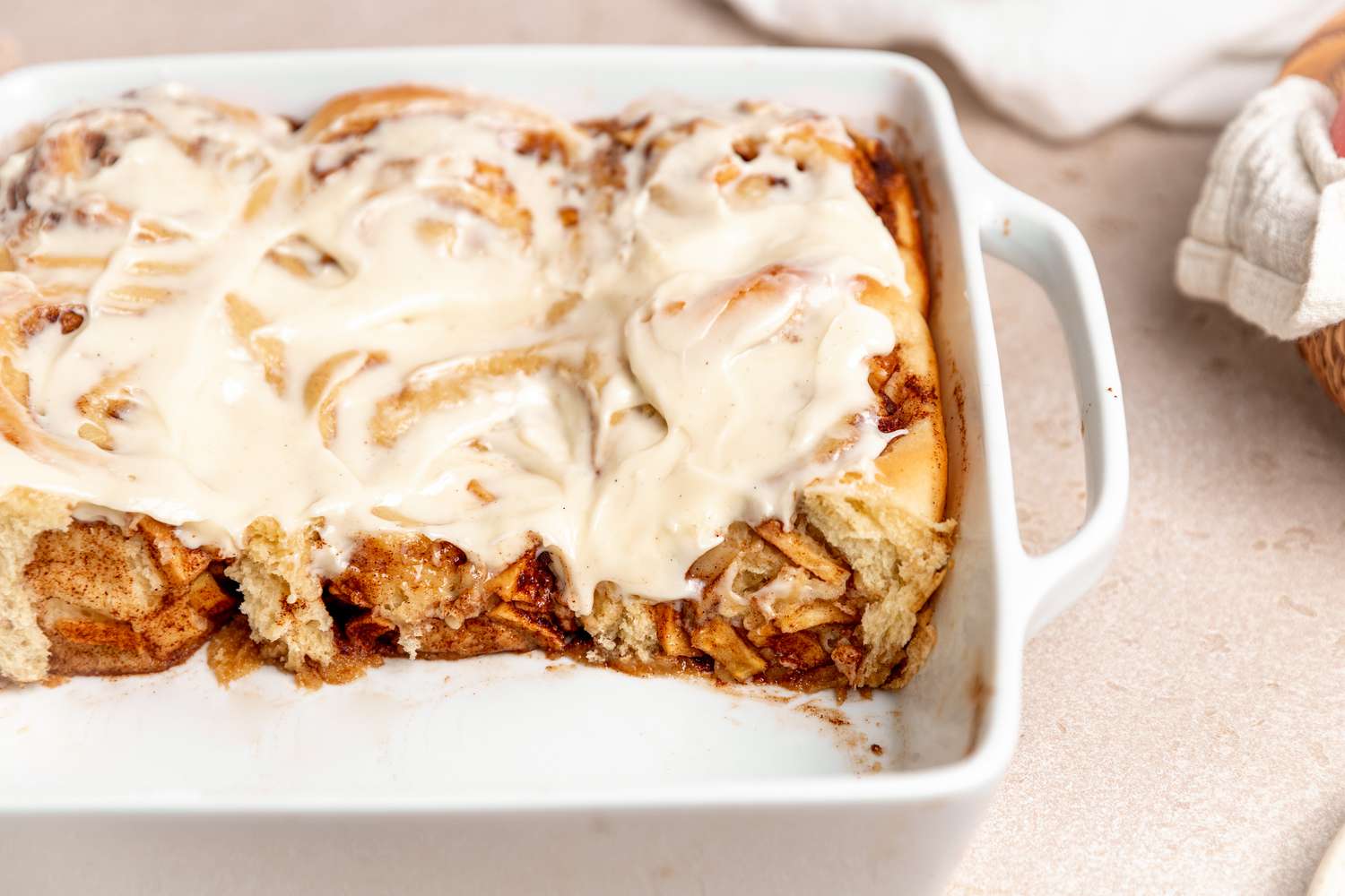 Apple Cinnamon Rolls in a Tray with a Couple Missing