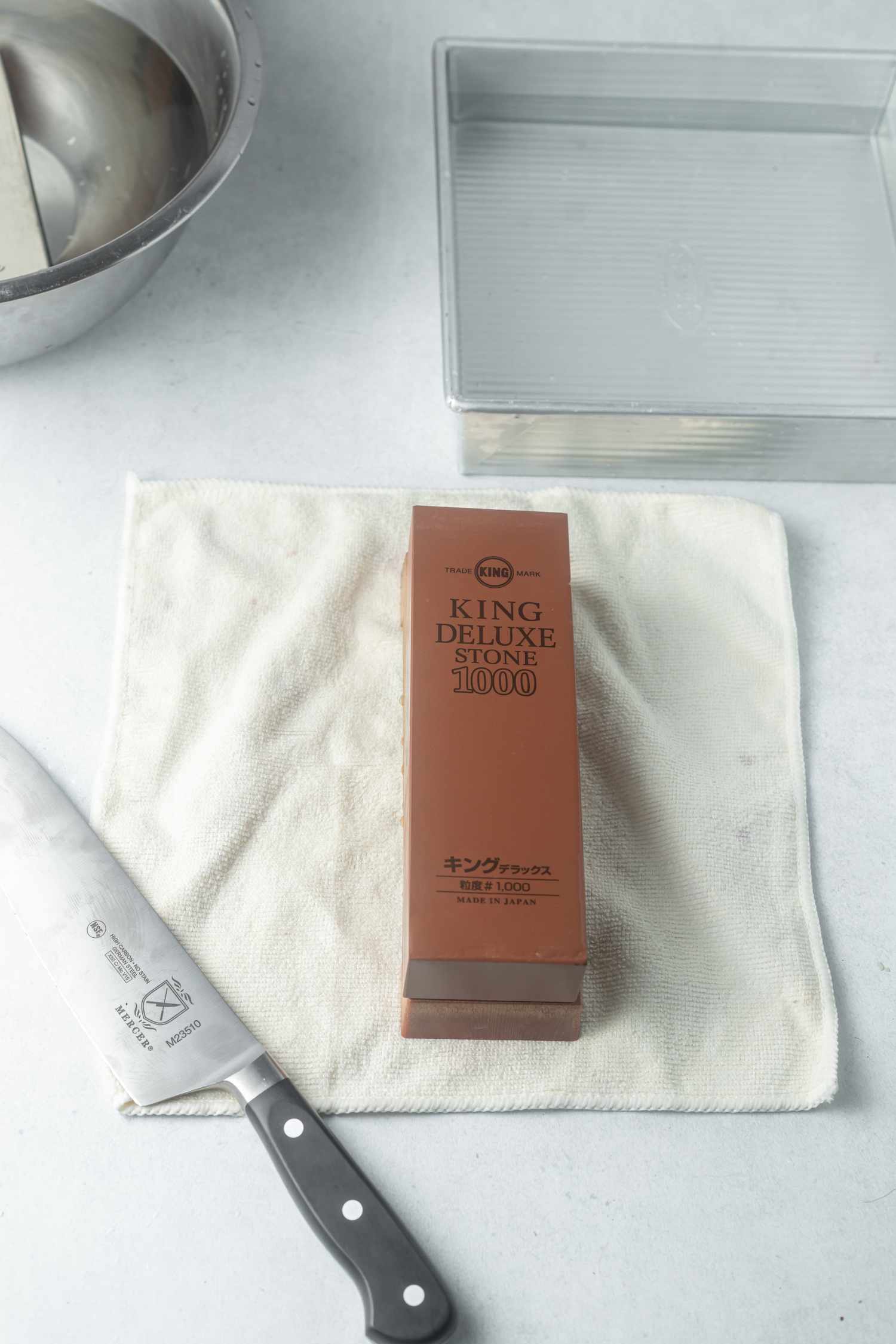 Whetstone placed in the center of a kitchen towel