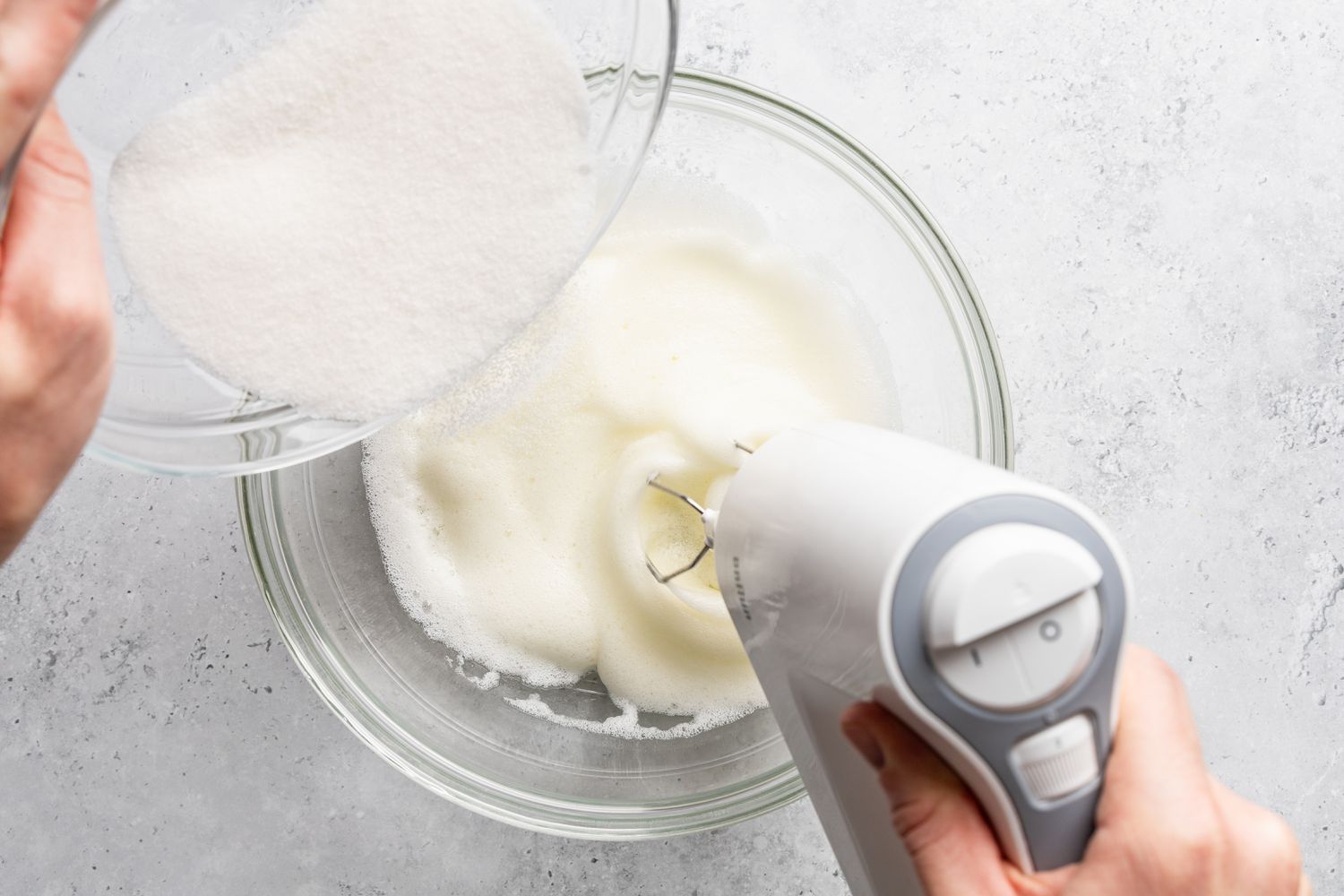 sugar slowly incorporated into the eggs whites while whisked to stiff peaks for soda cracker pie recipe