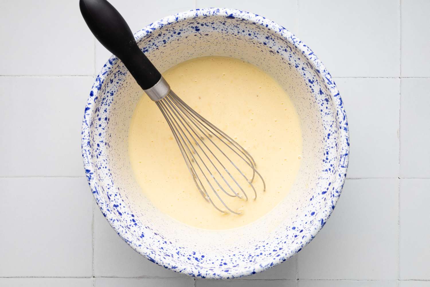 Buttermilk Whisked Into Bowl of Wet Ingredients for Banana Muffins with Chocolate Chips Recipe