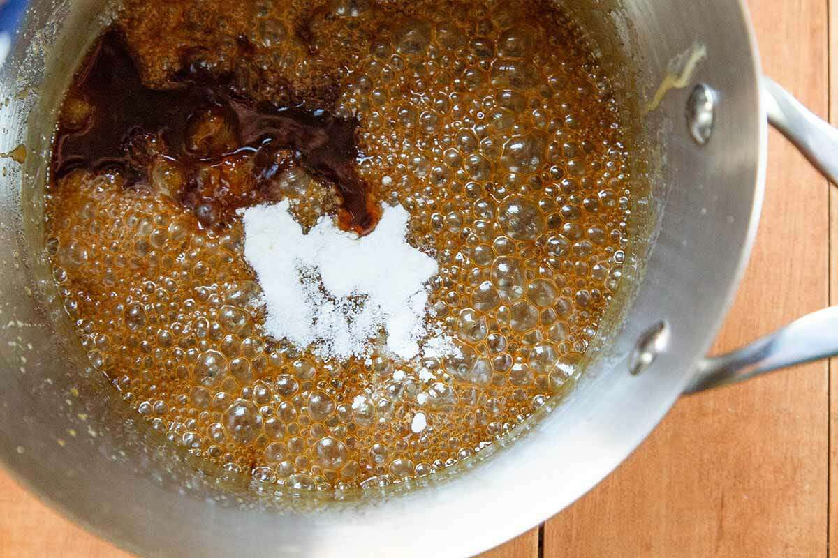 Peanut Brittle stir in the baking soda and vanilla