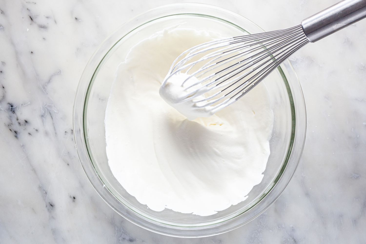 Bowl of Whipped Cream with a Whisk for Strawberry Eton Mess