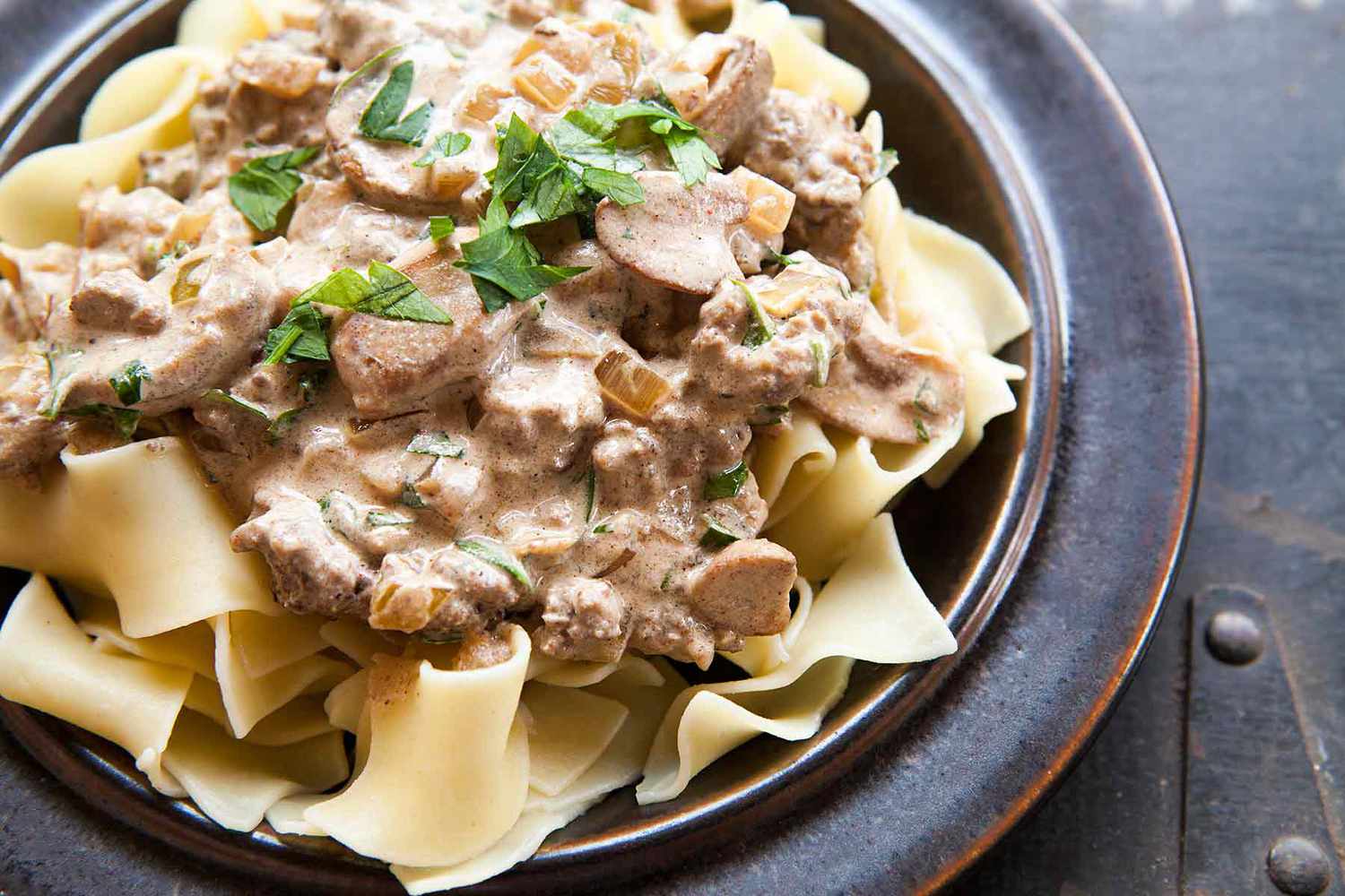 A plate of noodles topped with creamy hamburger stroganoff