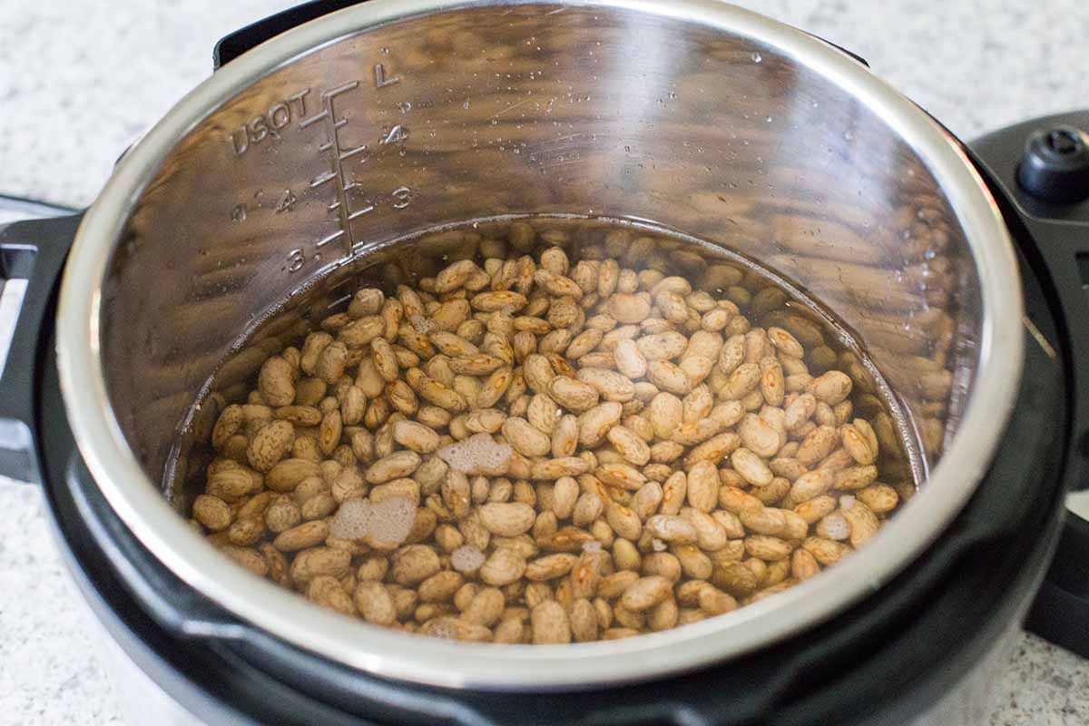Beans soaking in the insert of an Insant Pot for easy refired beans.