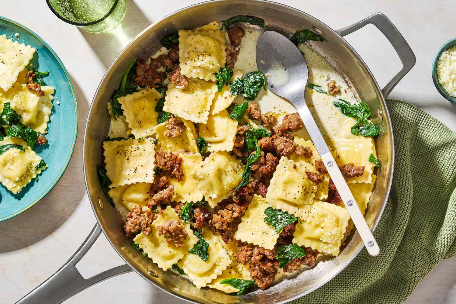 One-Pan Ravioli in a pan with a large spoon