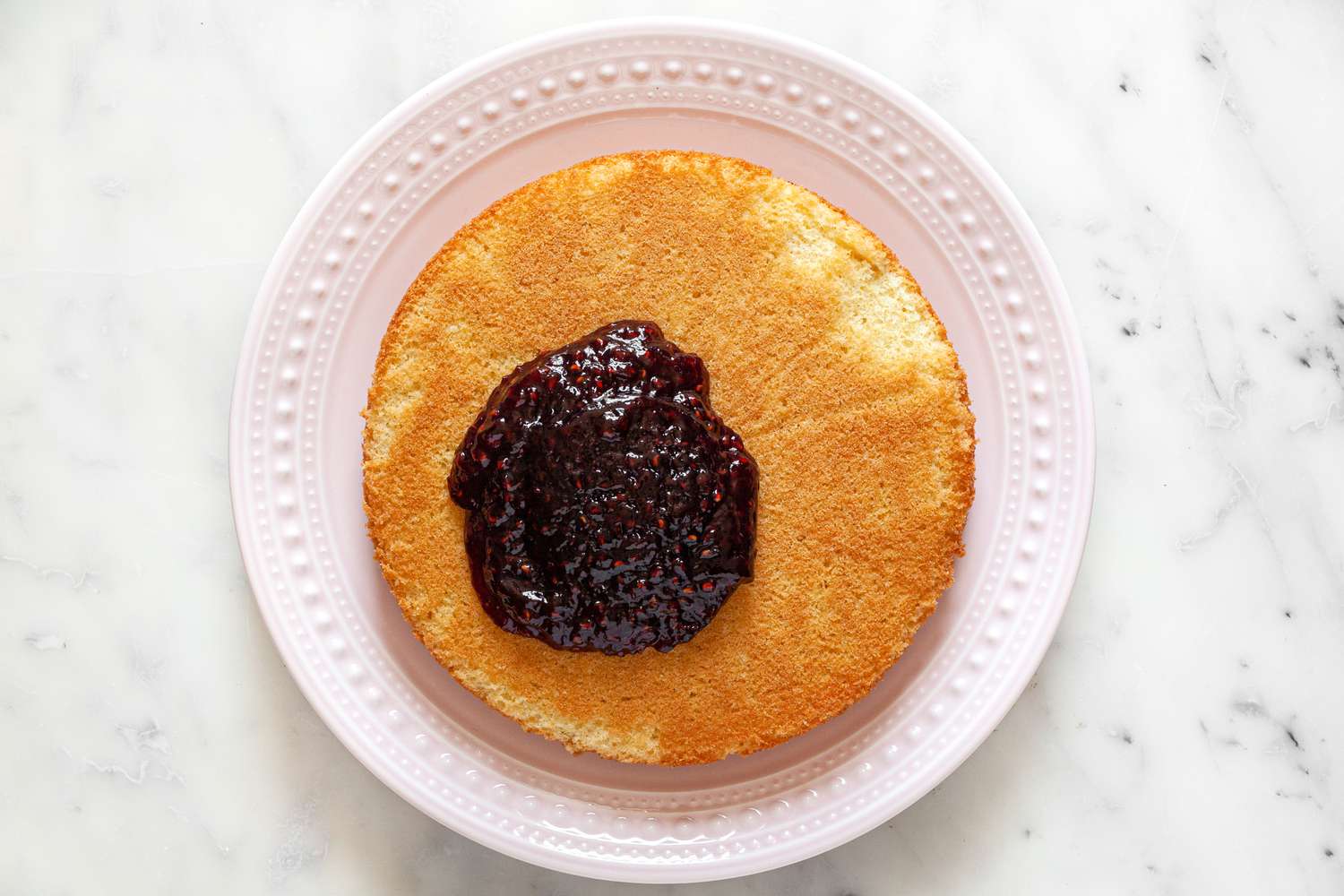 Victoria Sponge Cake Layer with Jam on It 
