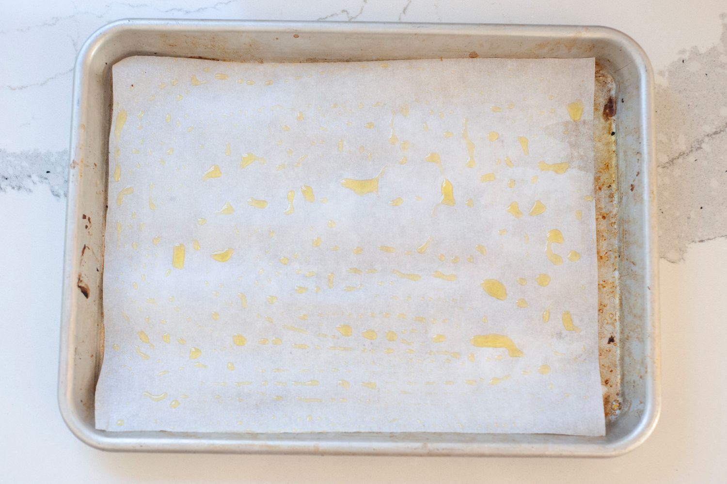 Parchment Paper on a Tray with Olive Oil for Roasted Tomatoes