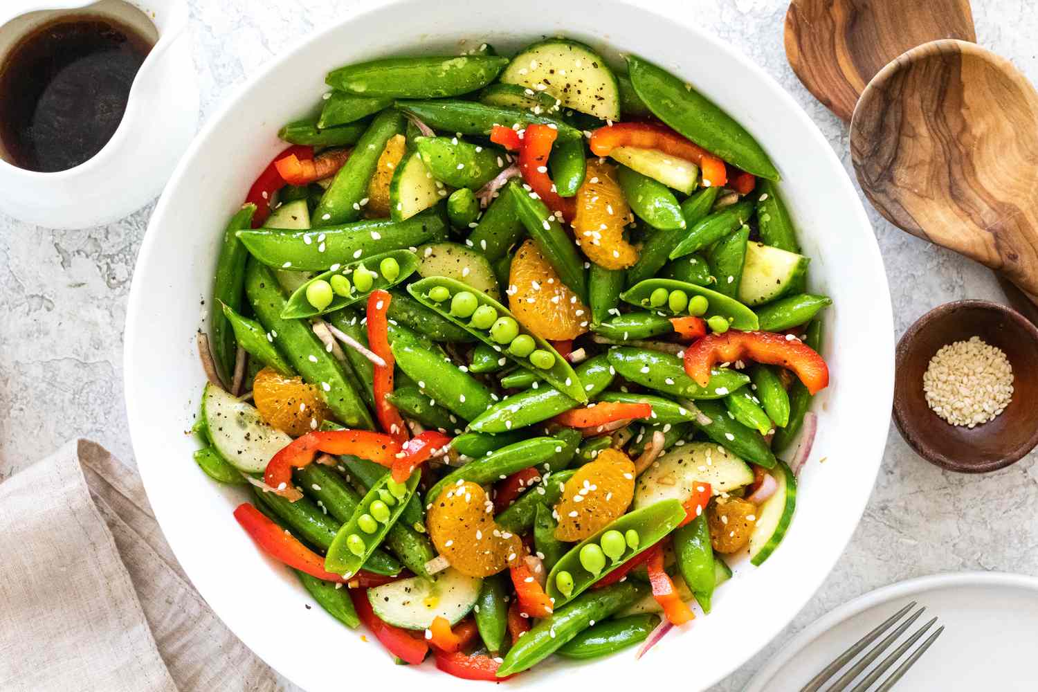 Spring snap pea salad in large serving bowl.