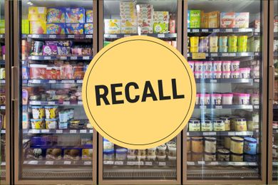 A supermarket freezer aisle with a large circular label Overlaid with Recall in bold text