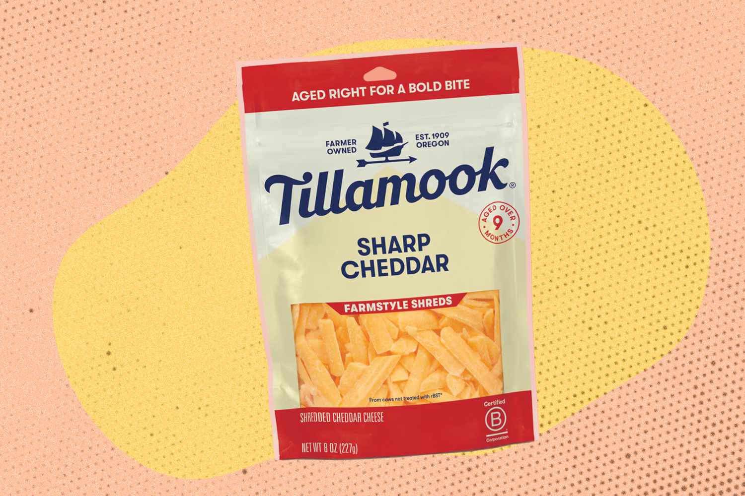 A package of Tillamook sharp cheddar cheese farmstyle shreds against a colorful background