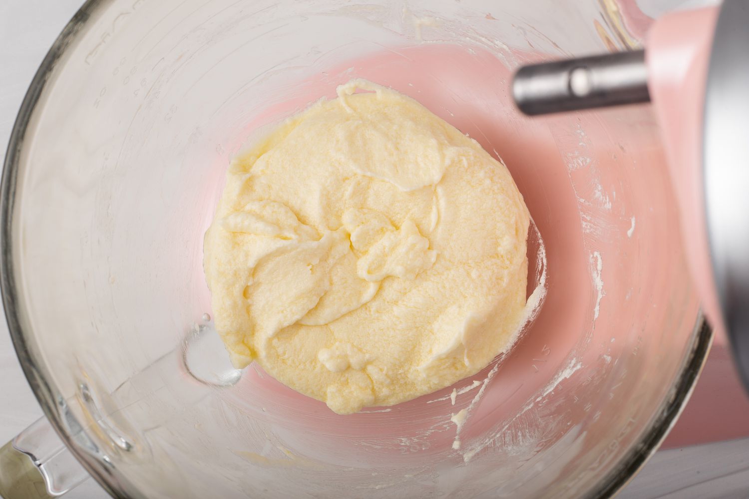 Overhead view of a bowl of batter to show how to make cupcakes.