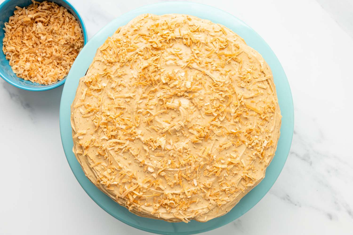 Coffee Coconut Banana Bread Cake Icing Topped With Toasted Coconut Flakes 