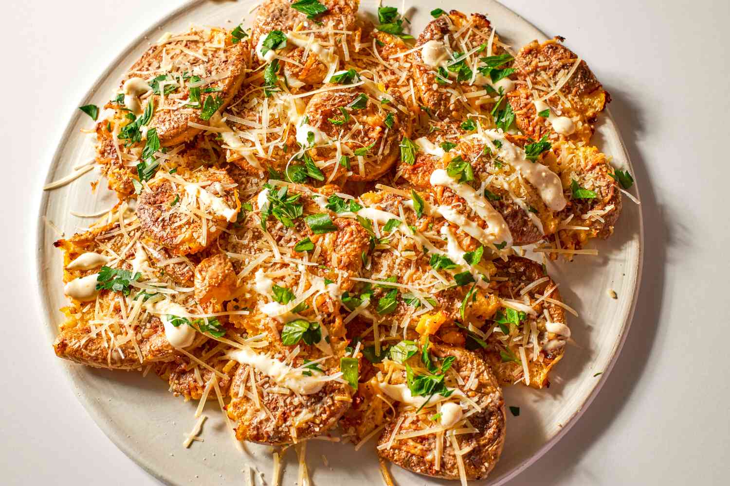 Crispy Caesar Smashed Potatoes on a platter