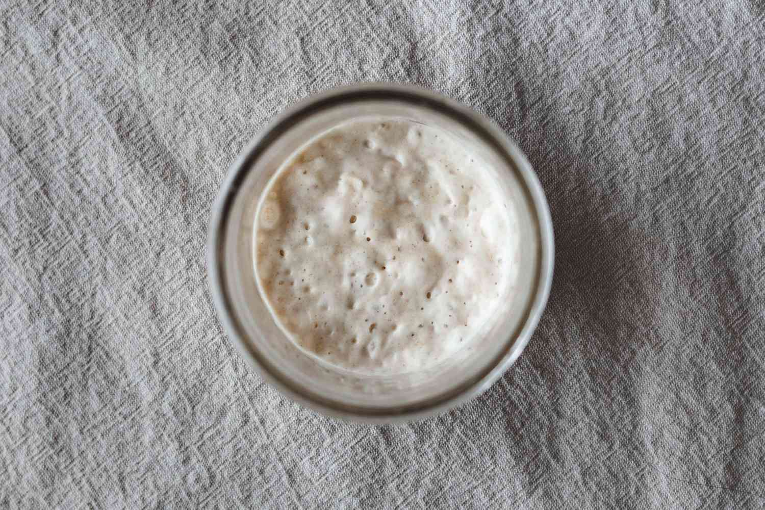 Overhead view of a mason jar to show how to make your own sourdough starter