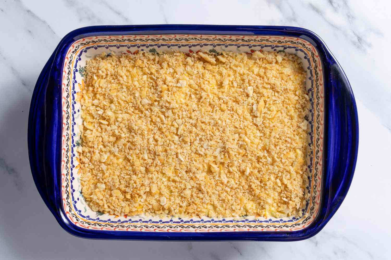 summer squash casserole filling topped with butered cracker pieces for southern summer squash recipe