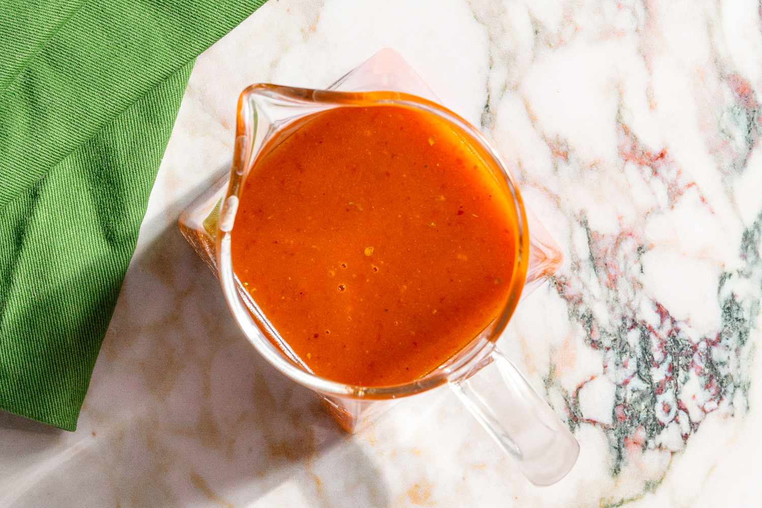overhead view of small sauce pitcher filled with Chipotle Honey Vinaigrette